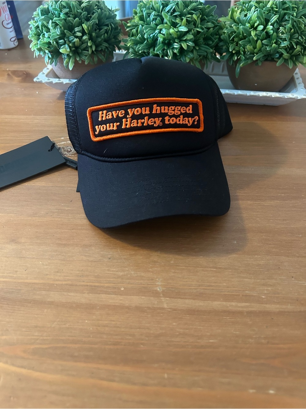 NWT Black Trucker Hat with Orange Patch "Have you hugged your Harley today?"